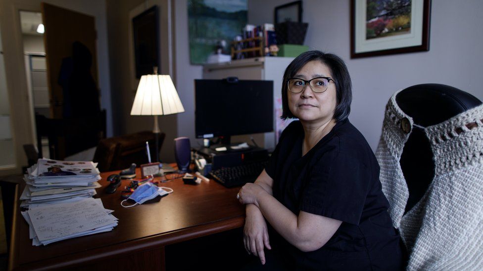 Dr Madeline Li sits in her office