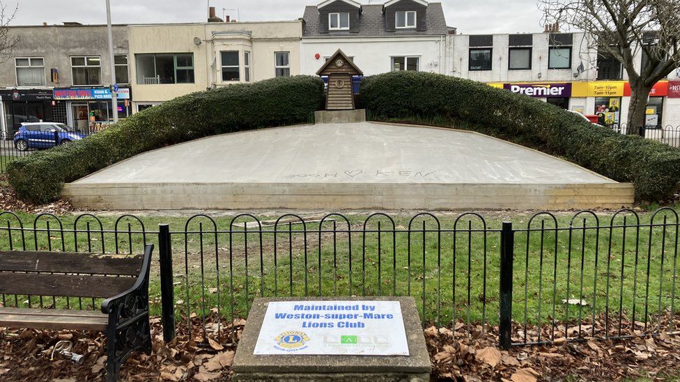 Floral clock concreted over