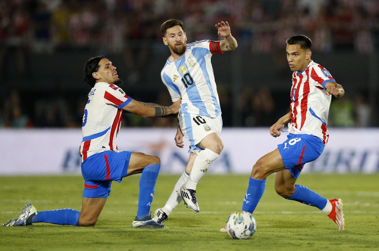 Argentina&#039;s Lionel Messi in action with Paraguay&#039;s Gustavo Gomez and Diego Gomez during South American Qualifiers, in Asuncion, Paraguay, Nov. 14, 2024. (Reuters Photo)