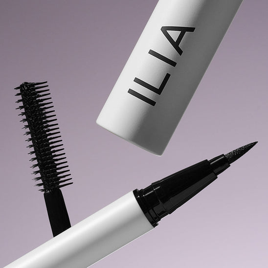 Image of black mascara open and closed against a purple background