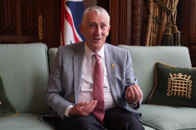 Sir Lindsay Hoyle in a grey suit, white shirt and salmon tie