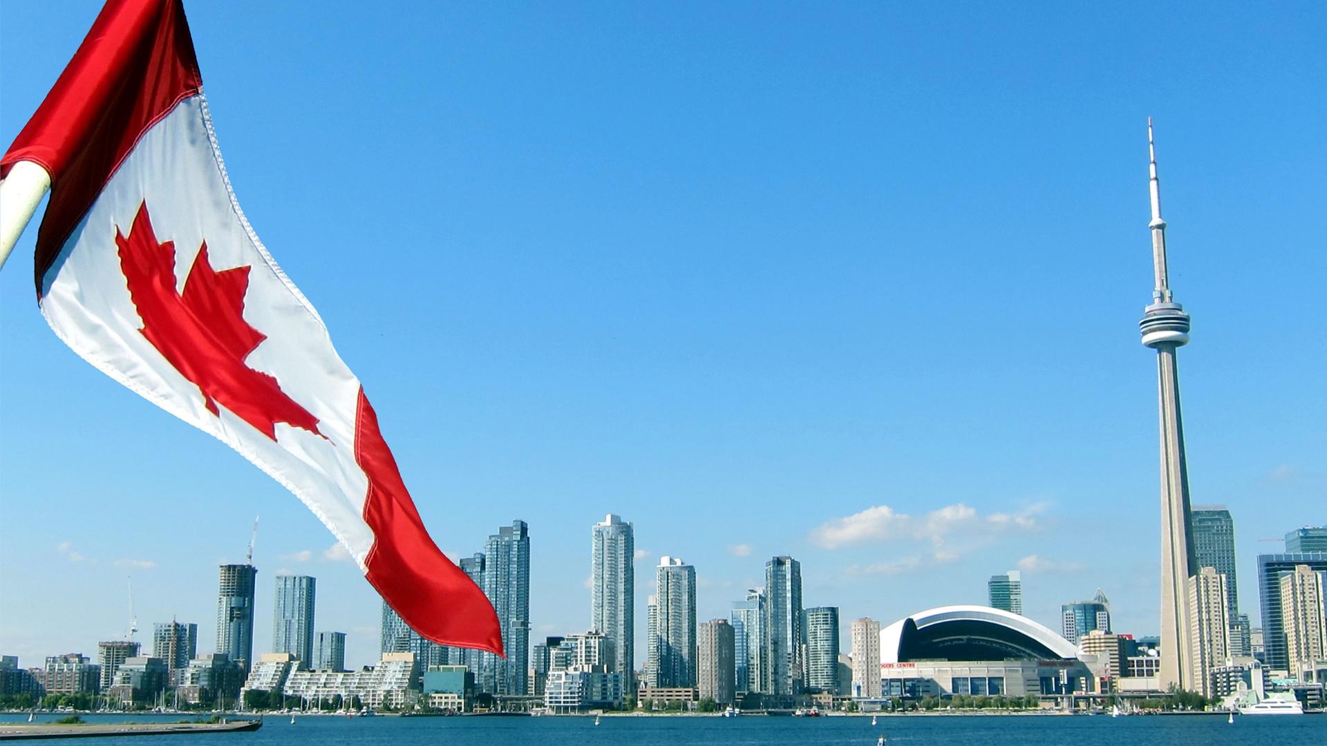 Canadian flag and Toronto skyline