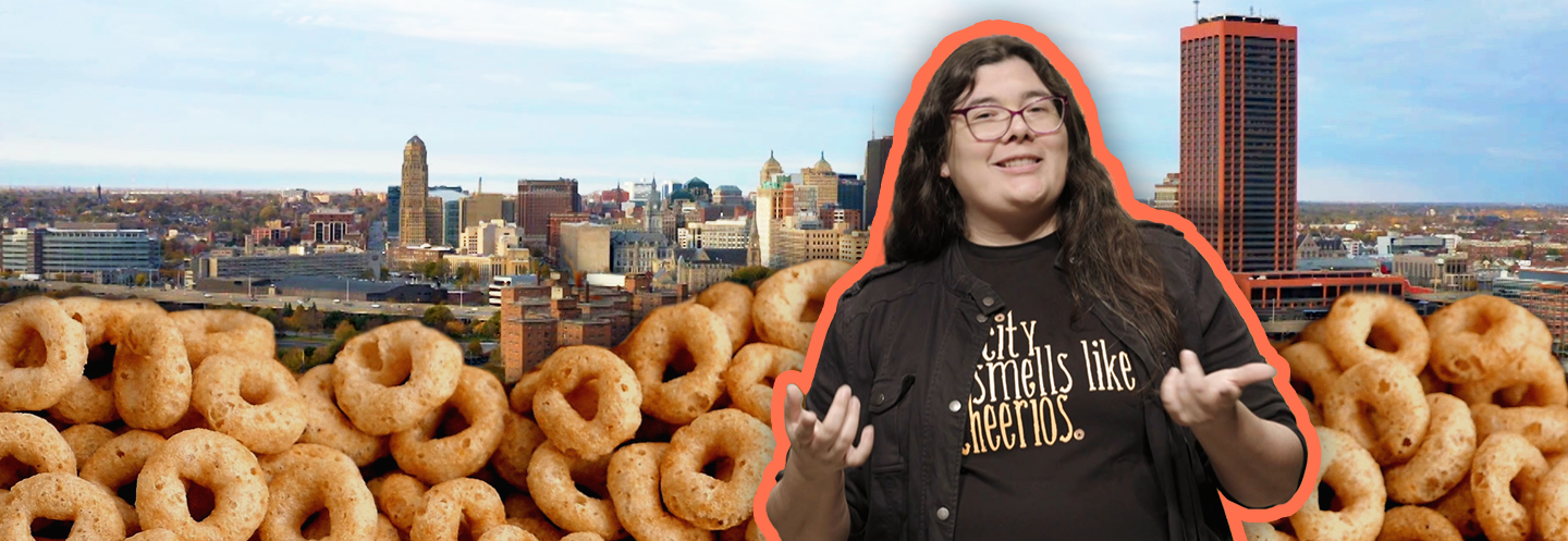 Sara in front of the City of Buffalo skyline with cheerios edited on the bottom