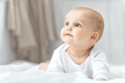 Portrait of a crawling baby on the carpet in my room