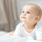 Portrait of a crawling baby on the carpet in my room