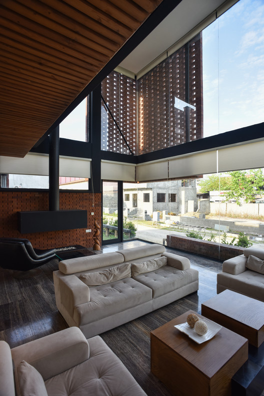 Maziar Brick House / Naghshe Khak Architectural Group - Sofa, Table, Windows, Chair, Beam