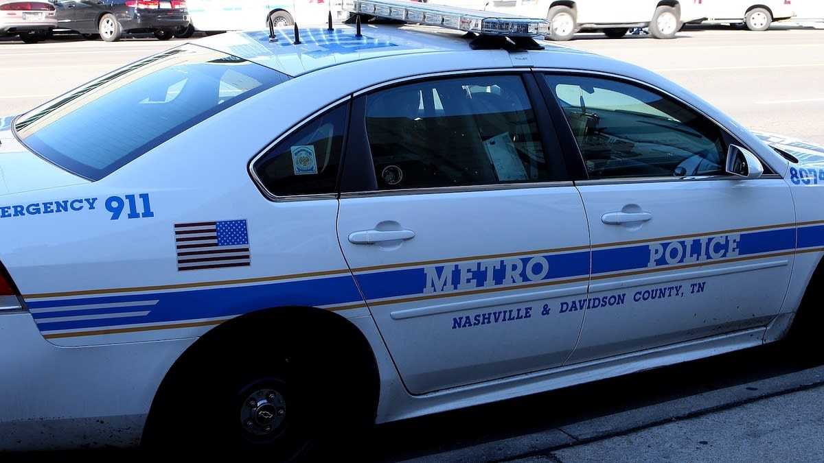 A parked Metro Police car with emergency 911 text, from Nashville/Davidson County