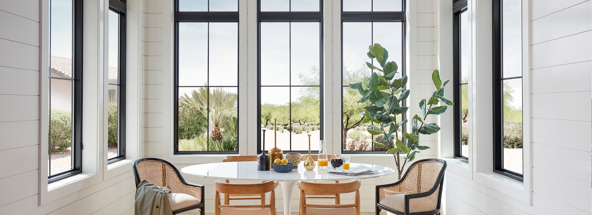 contemporary dining room with black impervia windows