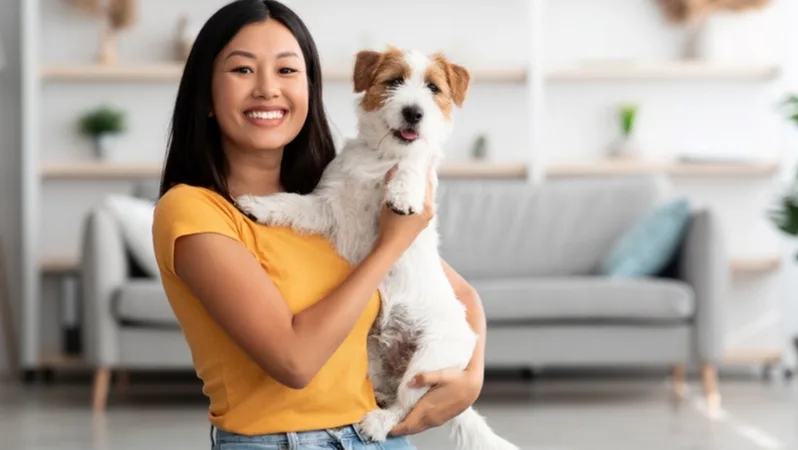 Photo of a woman holding her dog