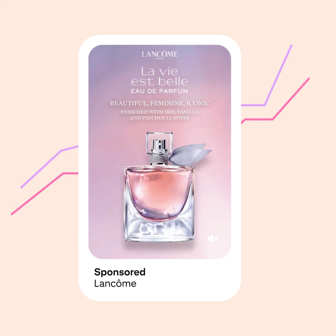 A Lancome ad shows a perfume bottle against a purple and pink background.