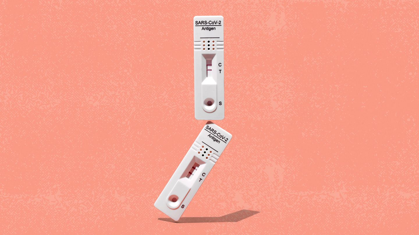 two positive Covid-19 tests balancing on top of each other
