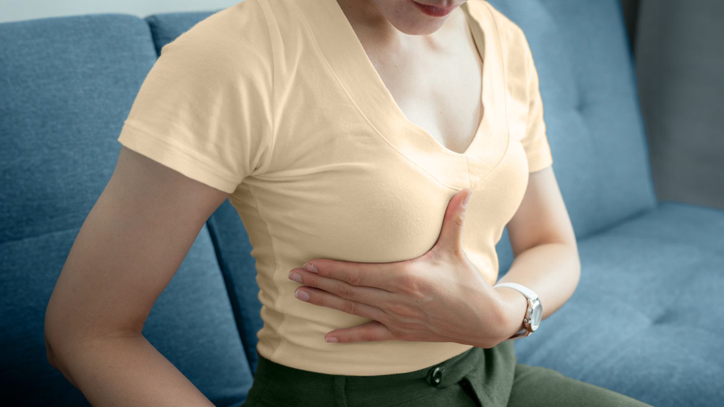 woman examining breast