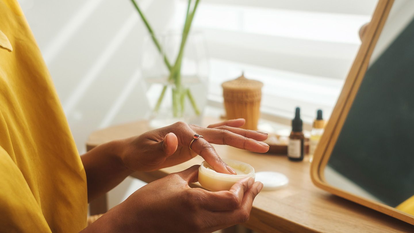 woman using vaseline as occlusive descaling technique