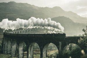 Black Train On Railway Bridge Under Heavy Clouds (1400x1050) Resolution Wallpaper