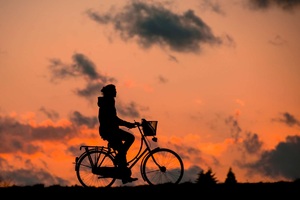 Cyclist Chasing Sky (2048x2048) Resolution Wallpaper