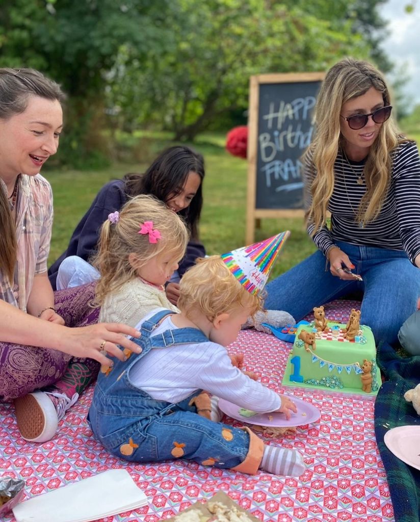 A photo of Carrie Johnson, Romy and Frankie having a picnic