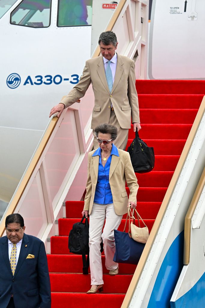 Britain's Princess Anne (C), Princess Royal and her husband Vice Admiral Timothy Laurence (top) arrives for a three days official visit to Sri Lanka at the Bandaranaike International Airport in Katunayake on January 10, 2024. 