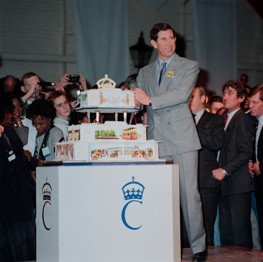 Prince Charles pictured with his tiered birthday cake at his 40th birthday party