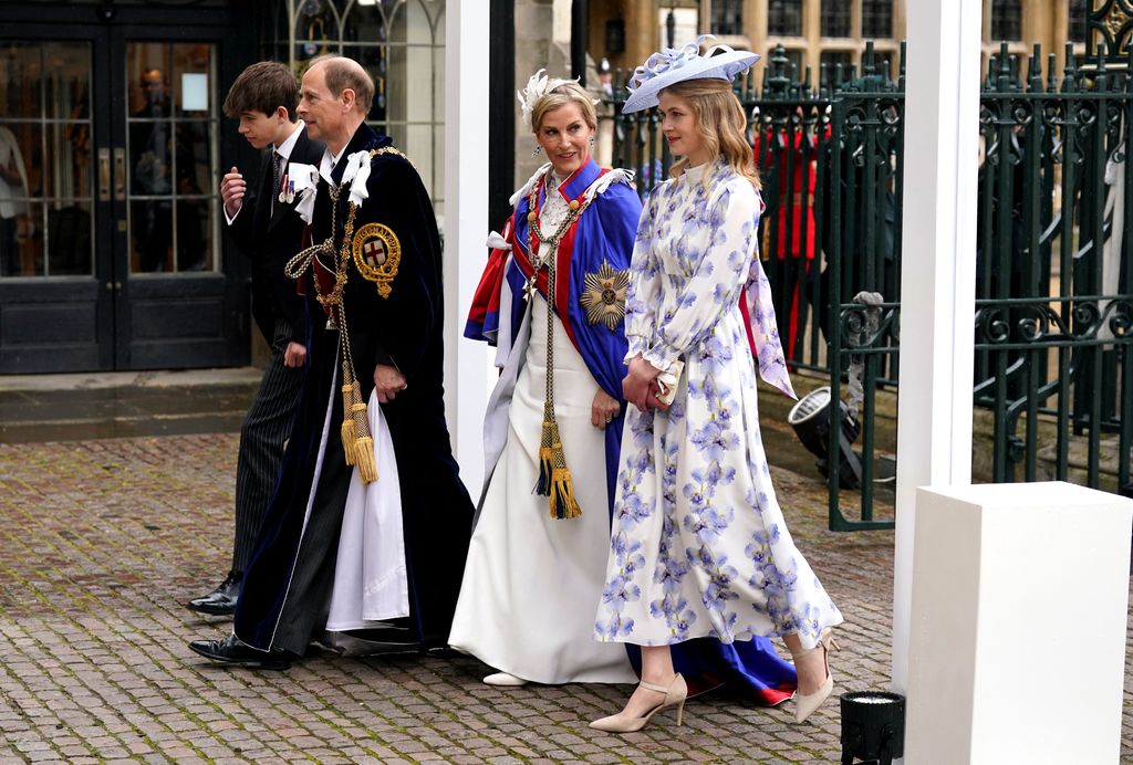 Lady Louise Windsor walks beside the Duke and Duchess of Edinburgh as she enters Westminster Abbey