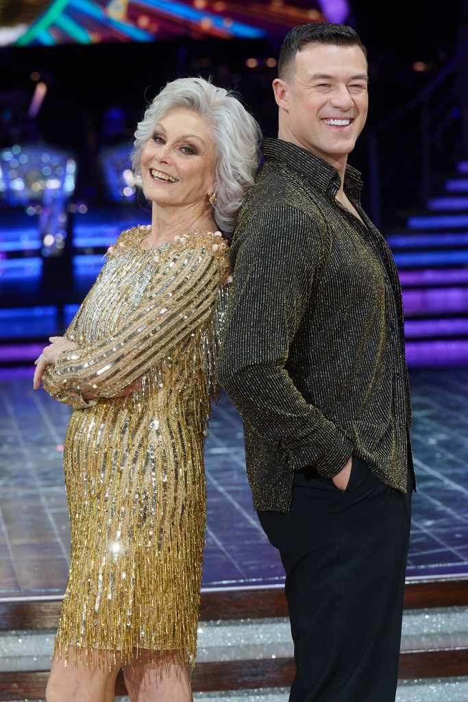 Angela Rippon and Kai Widdrington stood back-to-back