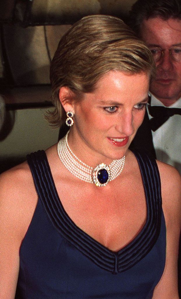 Princess Diana at th Fashion Awards at the Lincoln Center, New York, during a two-day visit to the city, January 1995. She is wearing a Catherine Walker gown and has her hair slicked back.
