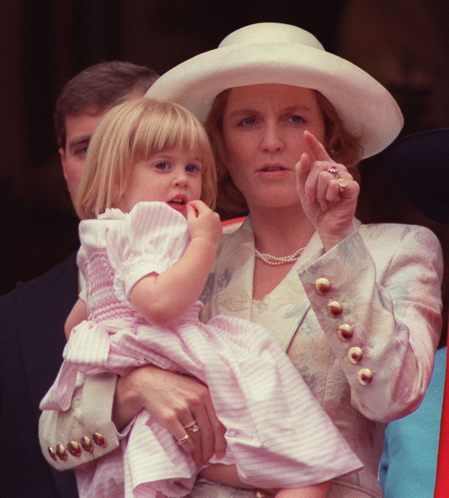 Sarah Ferguson holding Princess Beatrice on the palace balcony