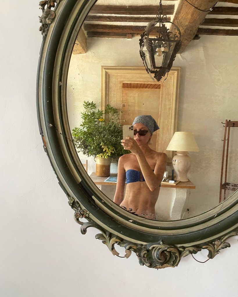 Princess Olympia of Greece wears a navy blue bikini