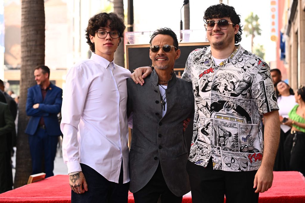 Marc Anthony poses with his sons Ryan Adrian Muñiz (L) and Cristian Marcus Muñiz during the ceremony for his star on the Hollywood Walk of Fame in Hollywood, California on September 7, 2023