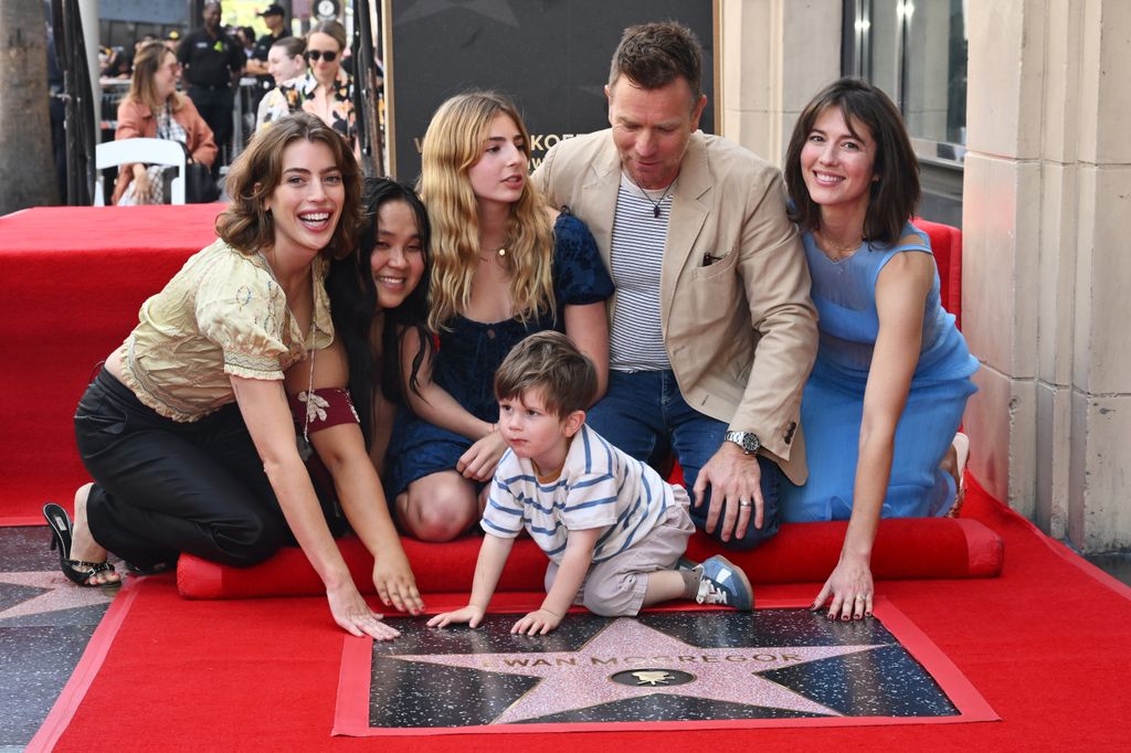 Ewan was joined by three of his daughters, his son, and wife, Mary