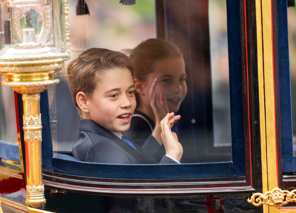 Prince George and Princess Charlotte of Wales wave during Trooping the Colour 2024 