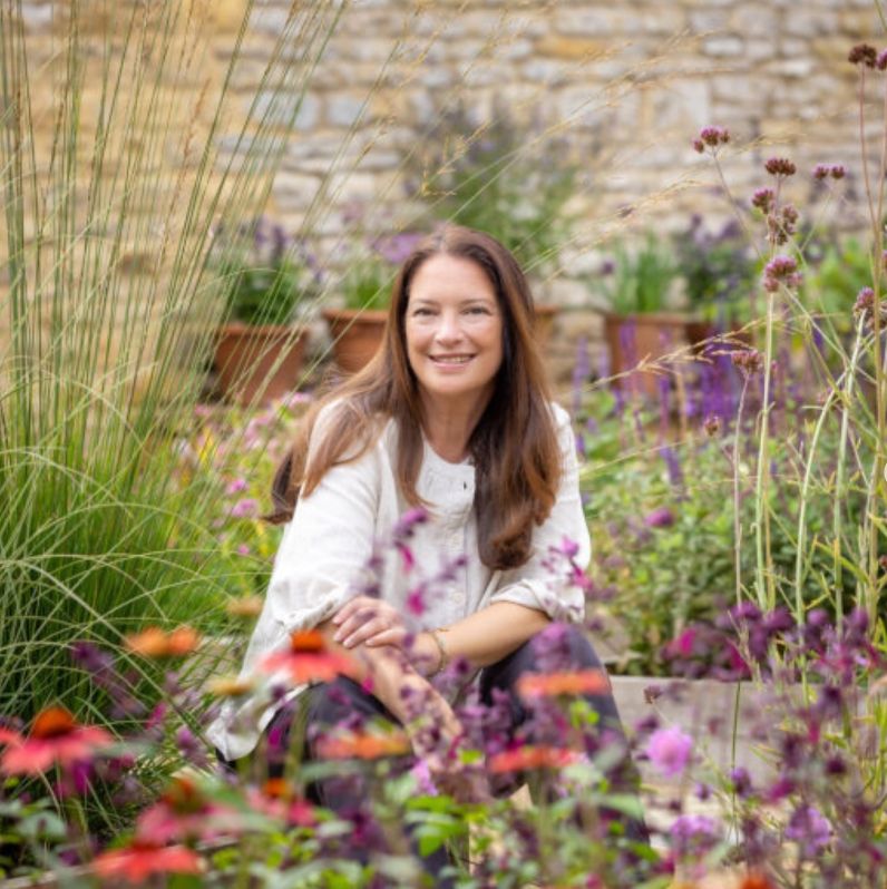 Rachel de Thame inside a garden