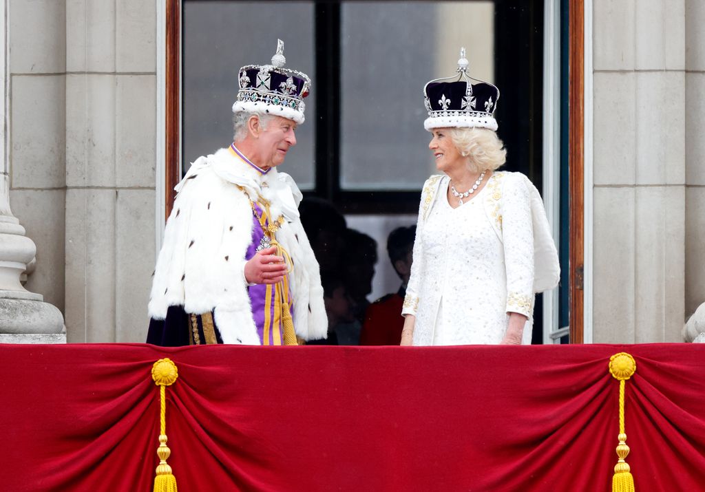 King Charles III and Queen Camilla watch an RAF flypast from the balcony of Buckingham Palace following their coronation at Westminster Abbey on May 6, 2023 in London, England. The Coronation of Charles III and his wife, Camilla, as King and Queen of the 