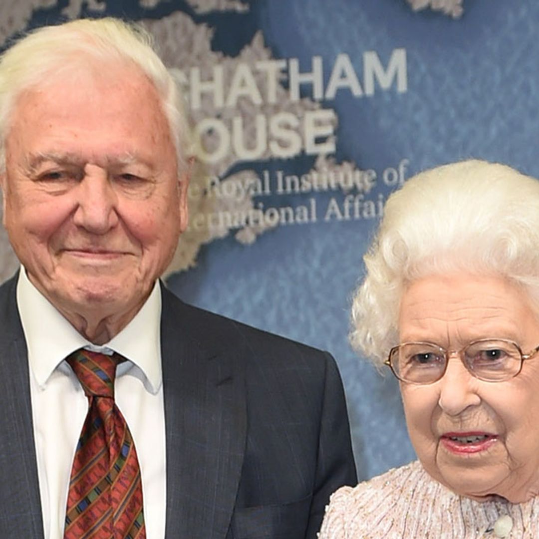 The Queen presents Sir David Attenborough with an award moments after Prince Andrew steps back from public life