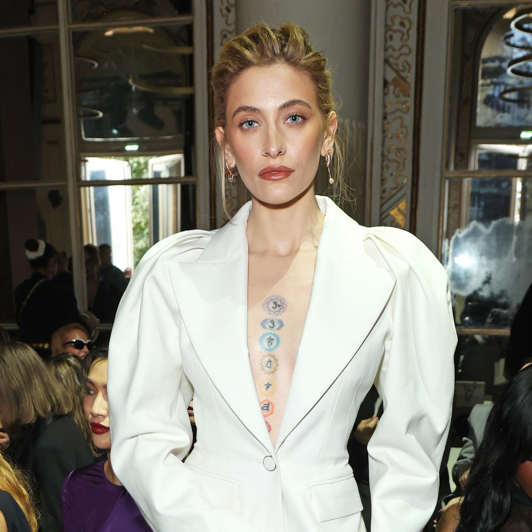 Paris Jackson showcases tattooed chest in plunging mini dress