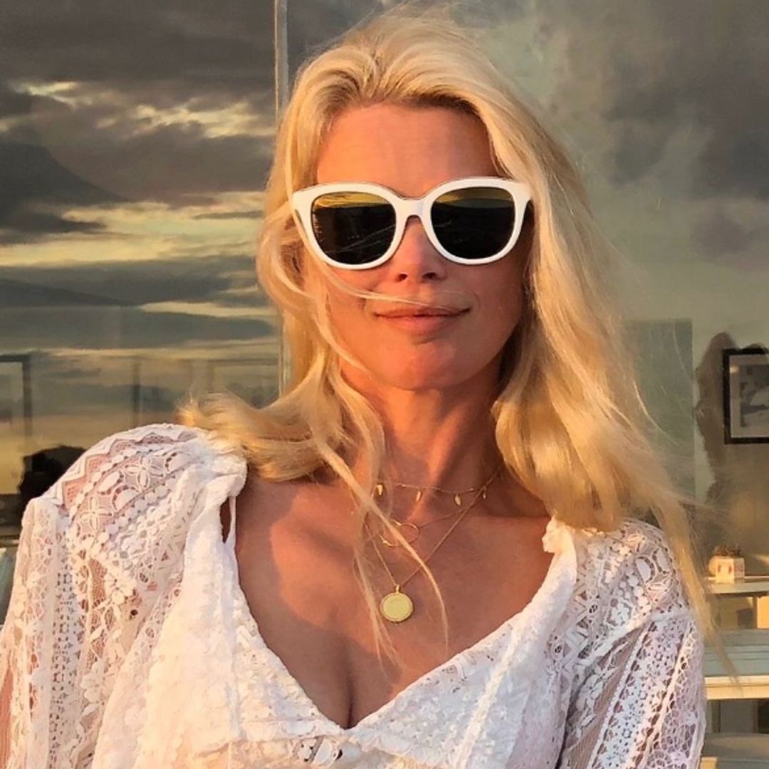 Claudia Schiffer shows off sculpted abs in glowing bikini video