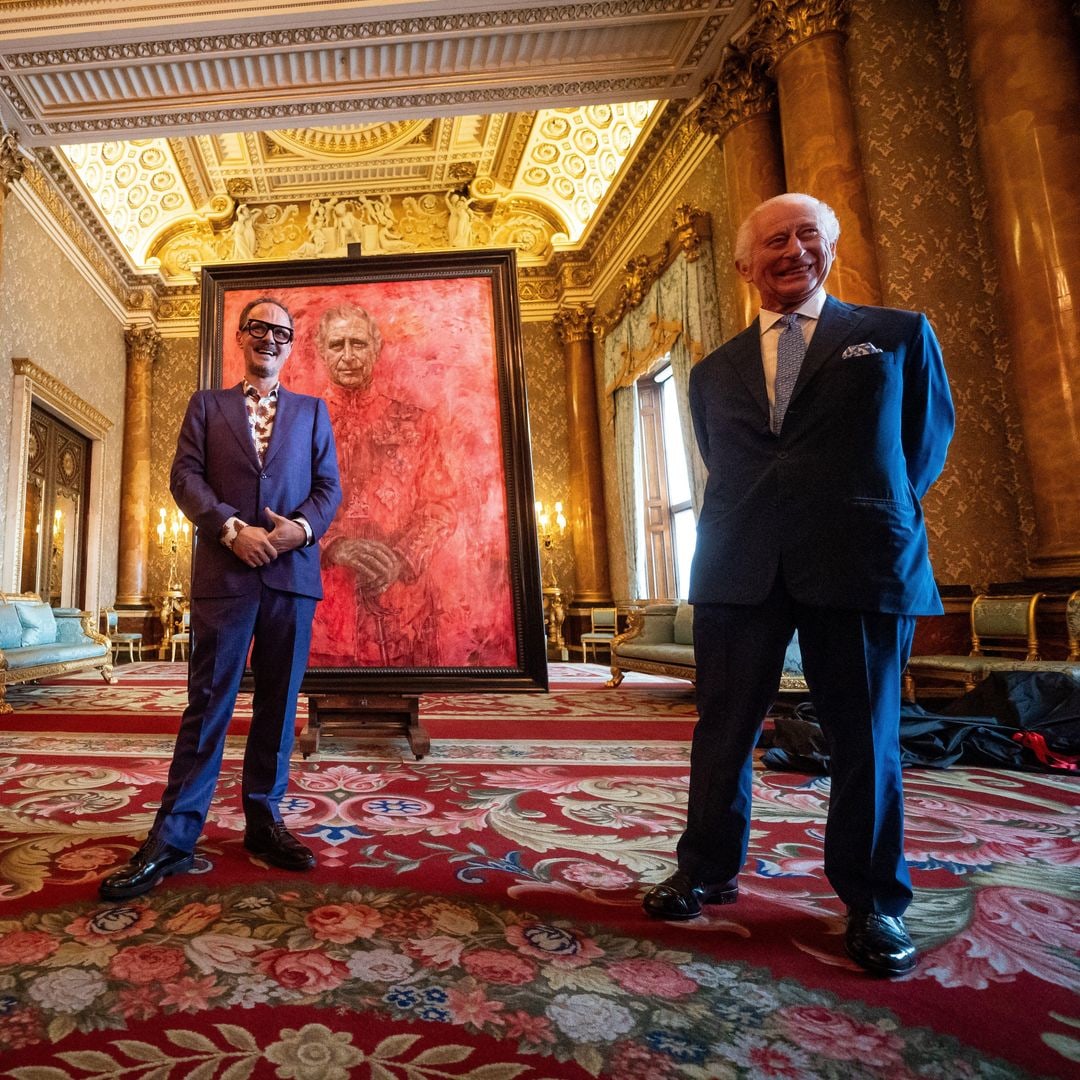 King Charles reacts as he unveils his first official portrait since coronation