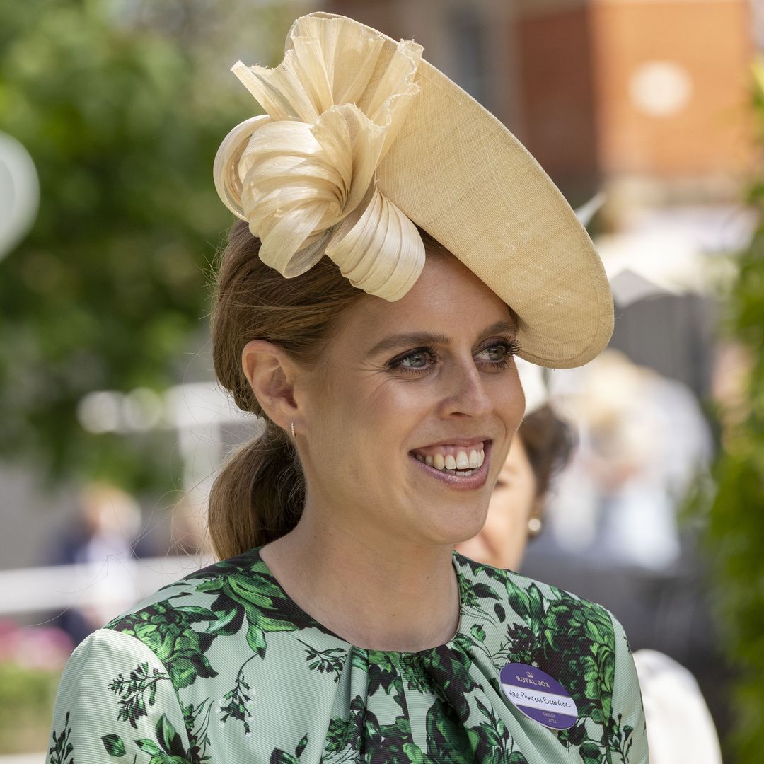 Pregnant Princess Beatrice blooms in floral wedding guest dress and whimsical flower crown