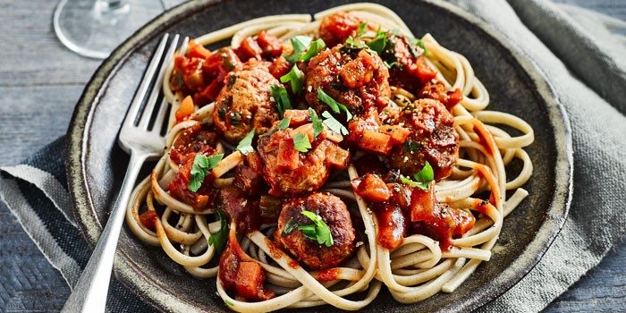 Slow cooker meatballs and spaghetti on a plate