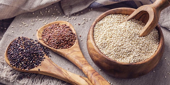 Various grains on spoons and in a bowl