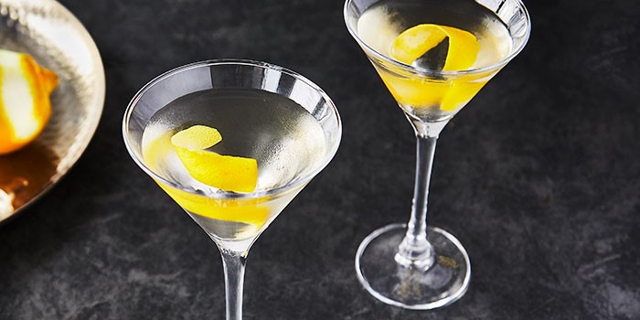 Two vodka martini's with lemon peel