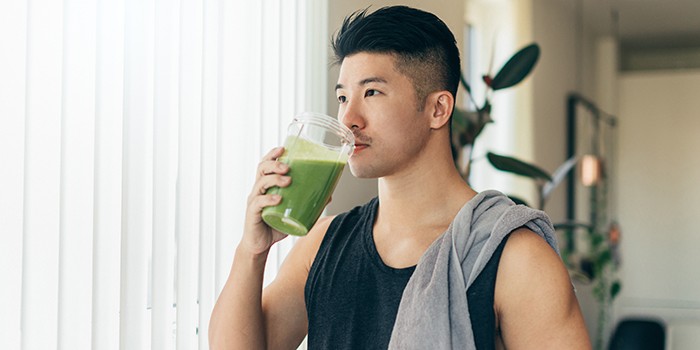 Man drinking a protein shake after a workout