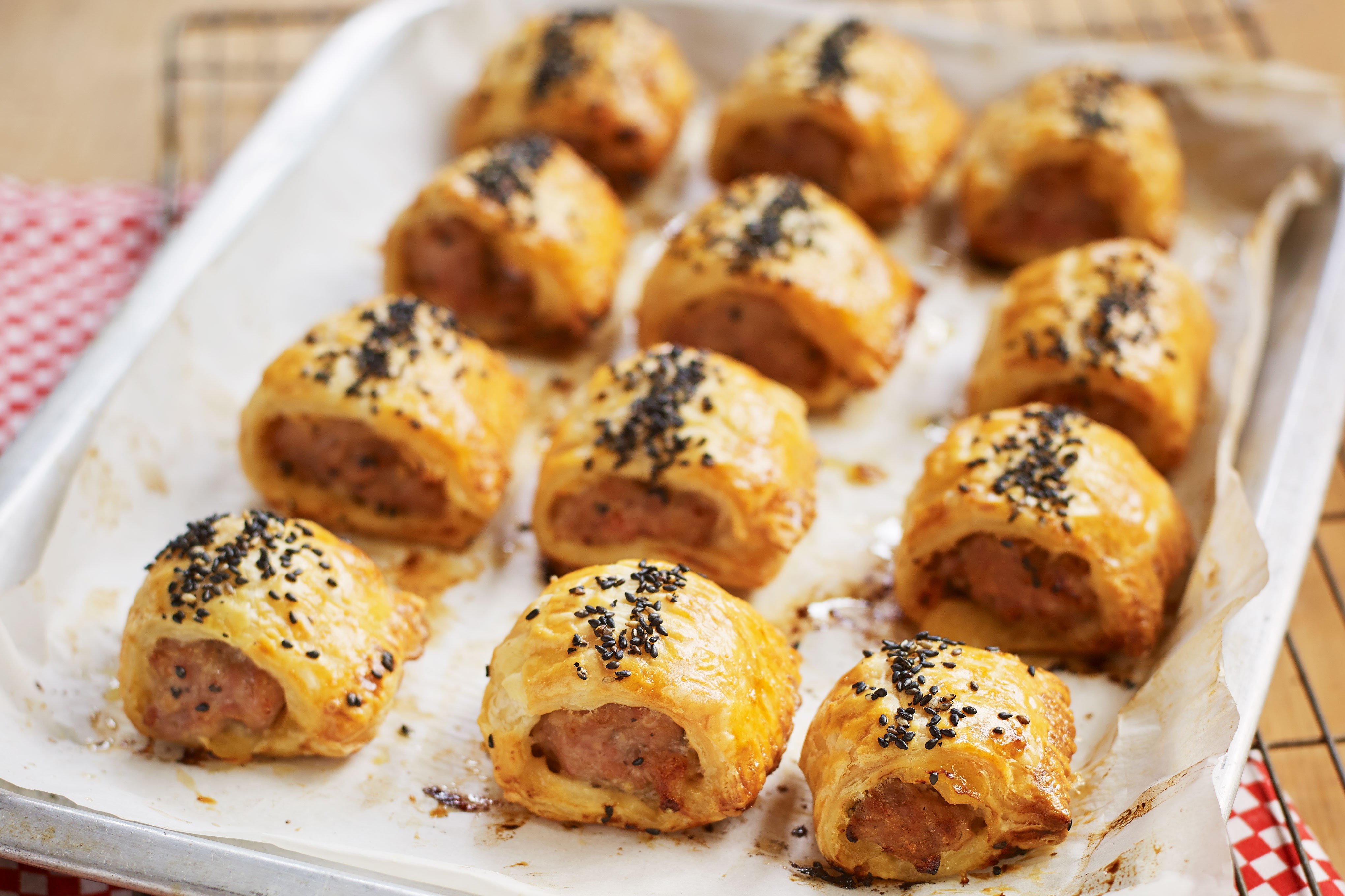 Mini sausage rolls on baking tray