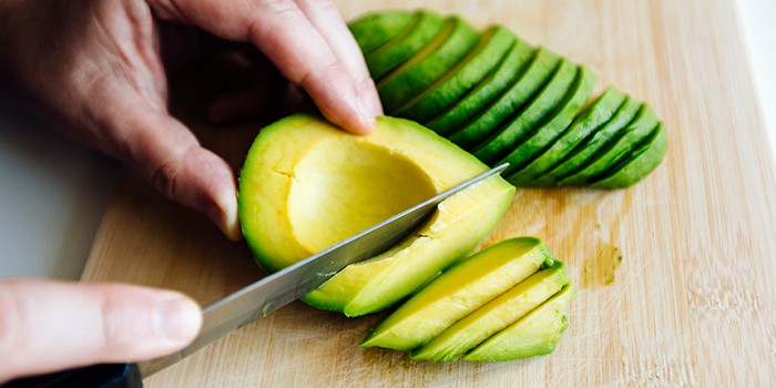 Slicing avocado with a knife