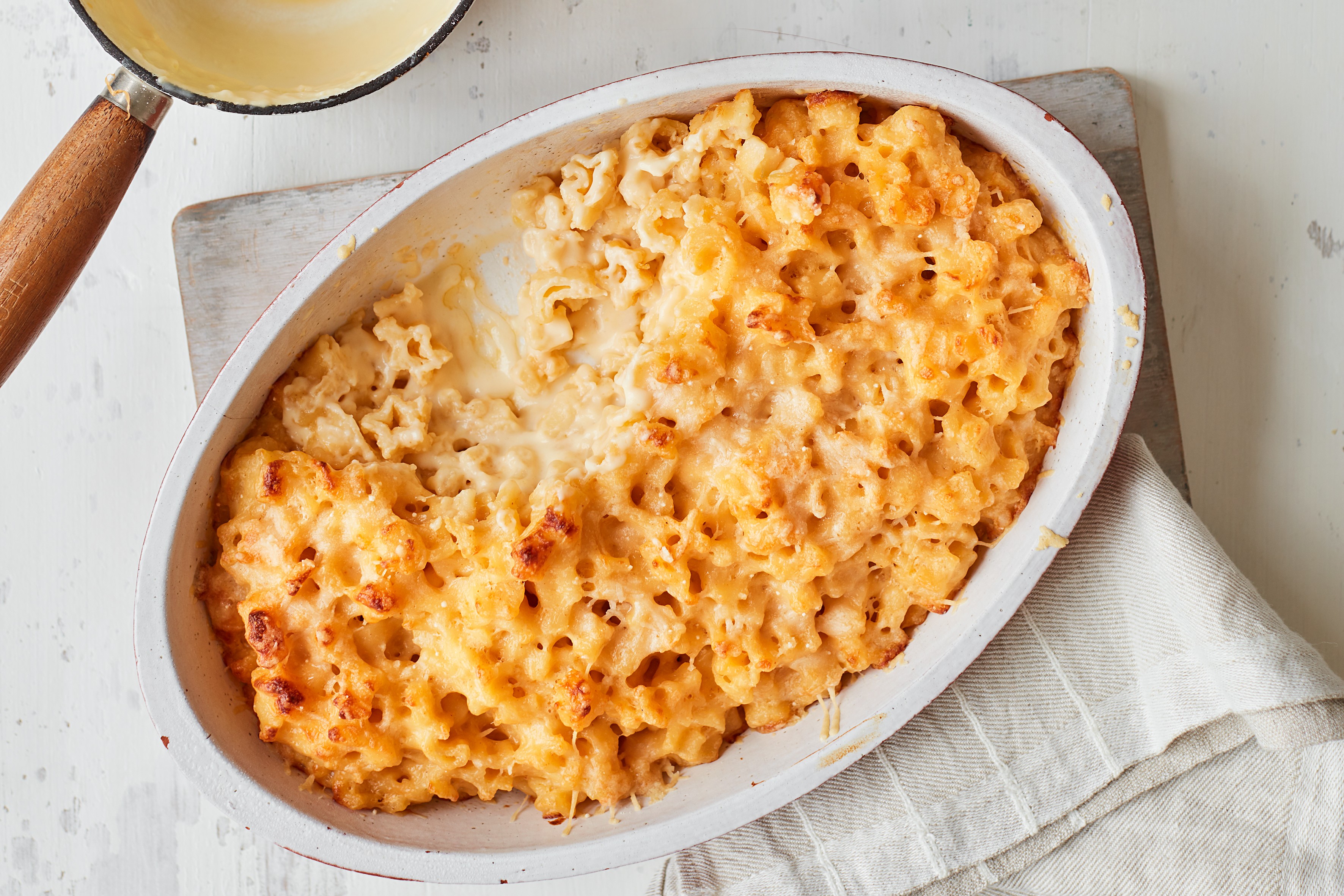 Cheeseboard macaroni cheese in an oval shaped baking dish