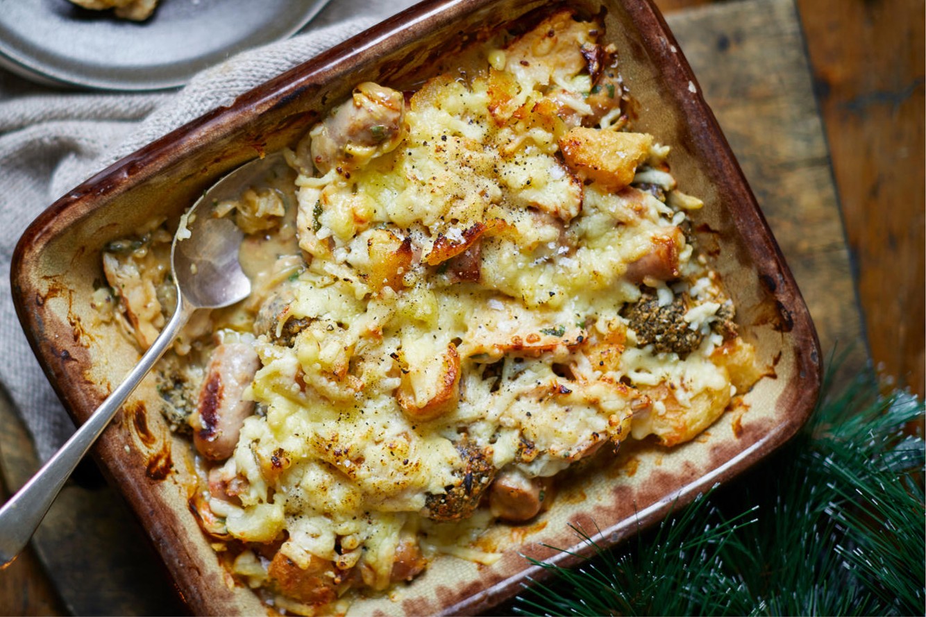 roast potato, turkey, stuffing and sausage pie in a rectangular pie dish