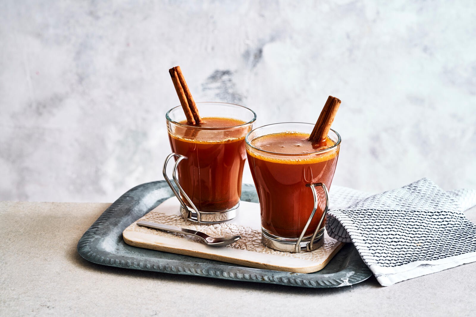 two glasses of hot buttered rum