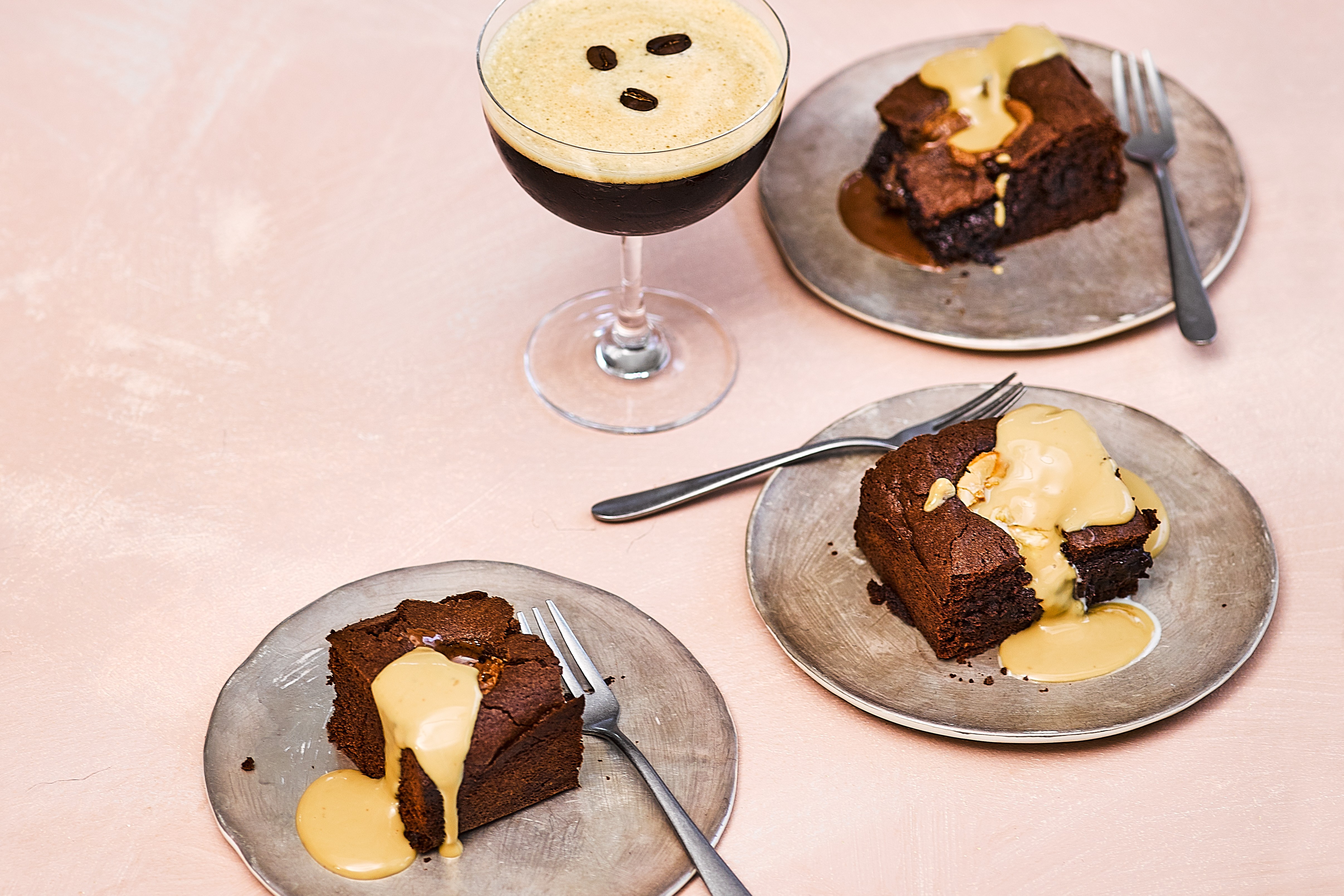 Three espresso martini brownies on decorative plates