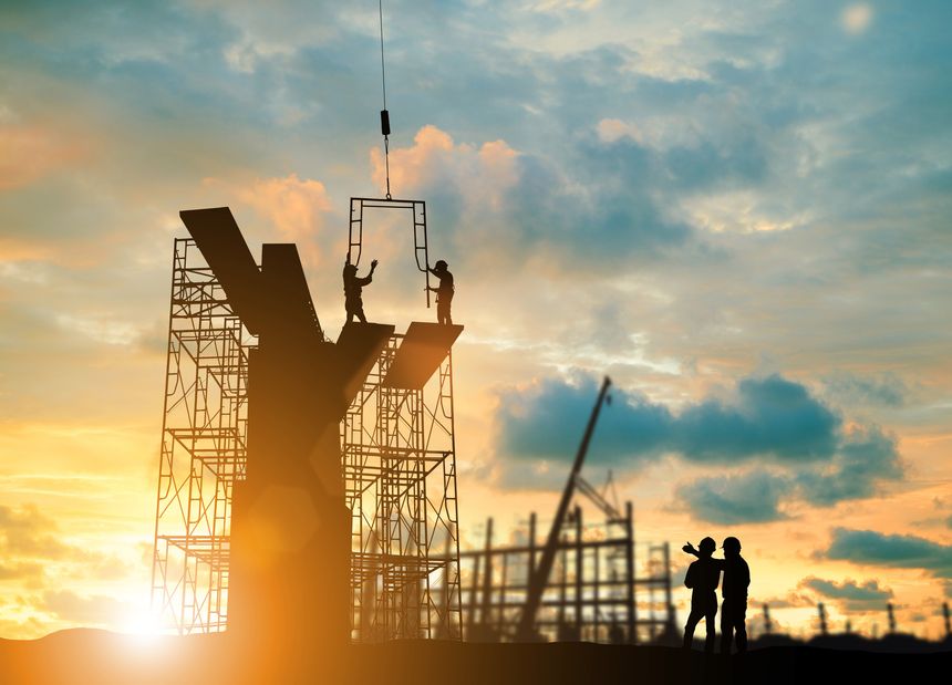 Silhouette engineer  look team construction safely to work load scaffolding over blurred background sunset pastel for industry background with Light fair