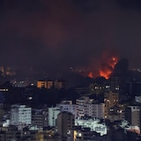 Fire and smoke rise over Beirut's southern suburbs after an airstrike.