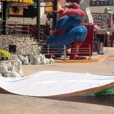 Workers remove a giant tarp on Wednesday in Cancun, Mexico, as the region prepares for the expected landfall of Hurricane Beryl. 